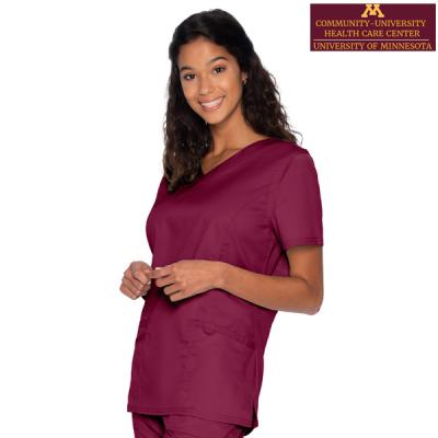 woman in maroon colored scrubs