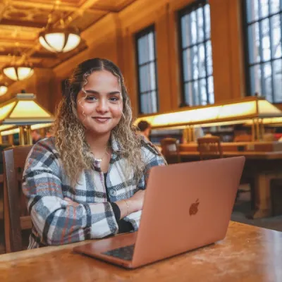 female student studying in library